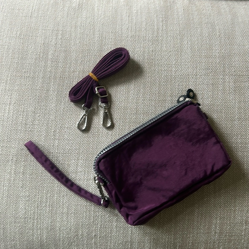 Purple Nylon Wristlet with Shoulder/Crossbody Strap. 3 zippered compartments.